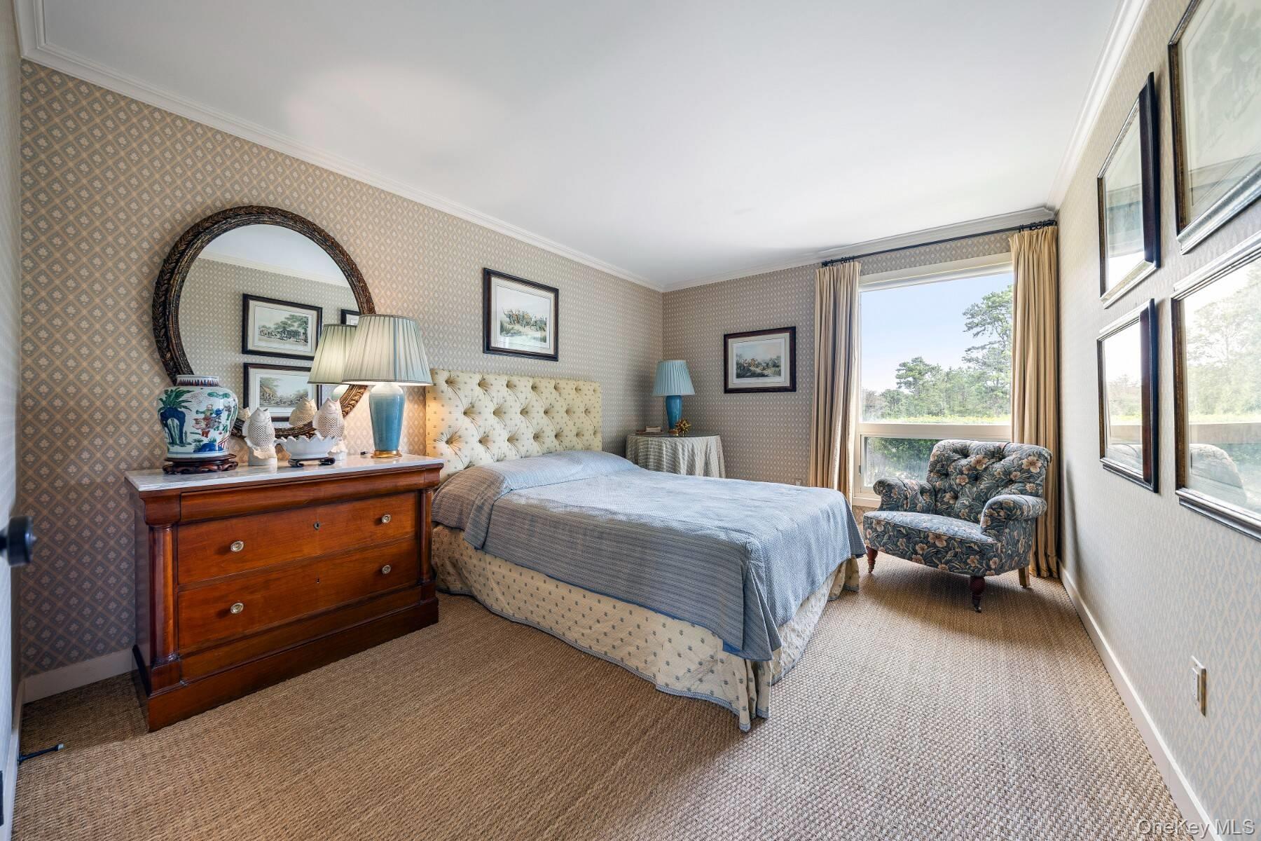 20 Hillside Road Southampton, NY 11968 - Photo 27 of 32 a bedroom with a bed and a large window