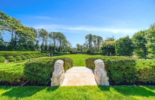 a garden view with a fountain