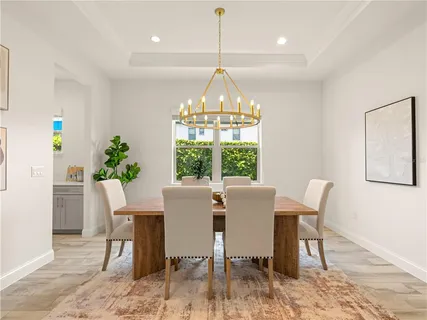 a view of a dining room with furniture window and outside view