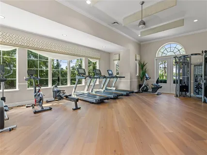 a living room with furniture and large windows