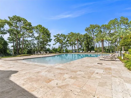 a view of swimming pool with a yard