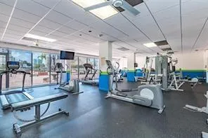 a room with lots of furniture and a large window