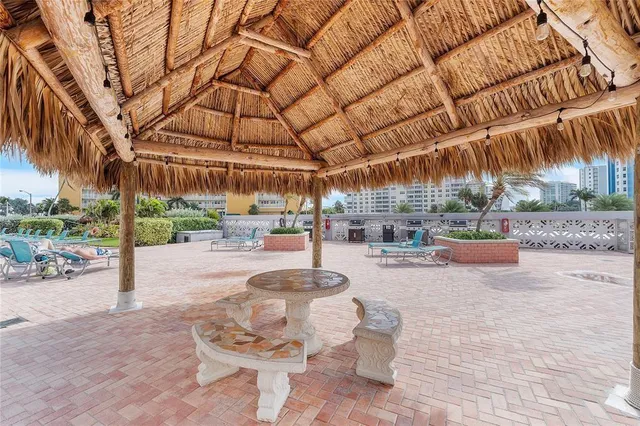a view of a chairs and tables in the patio