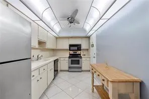 a kitchen with stainless steel appliances granite countertop a stove and a refrigerator