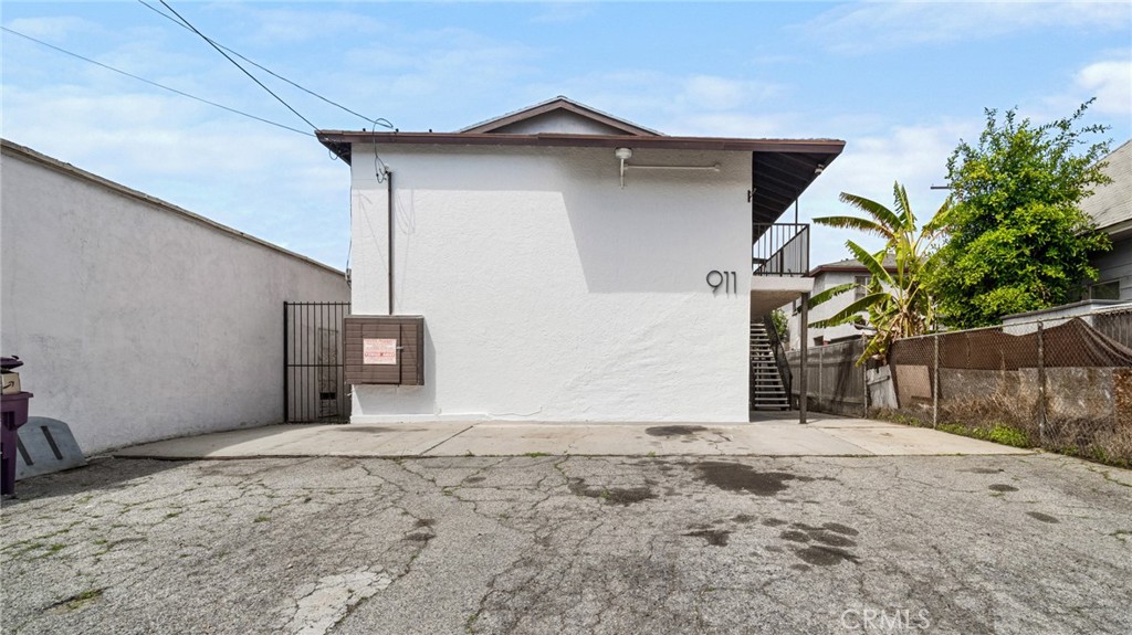 911 East 10th Street Long Beach, CA 90813 - Photo 4 of 19 a view of a house with a wooden fence