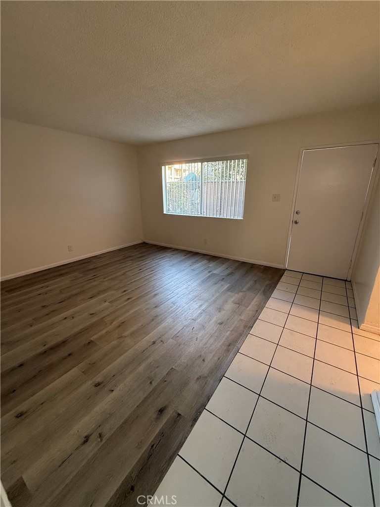 911 East 10th Street Long Beach, CA 90813 - Photo 7 of 19 an empty room with wooden floor