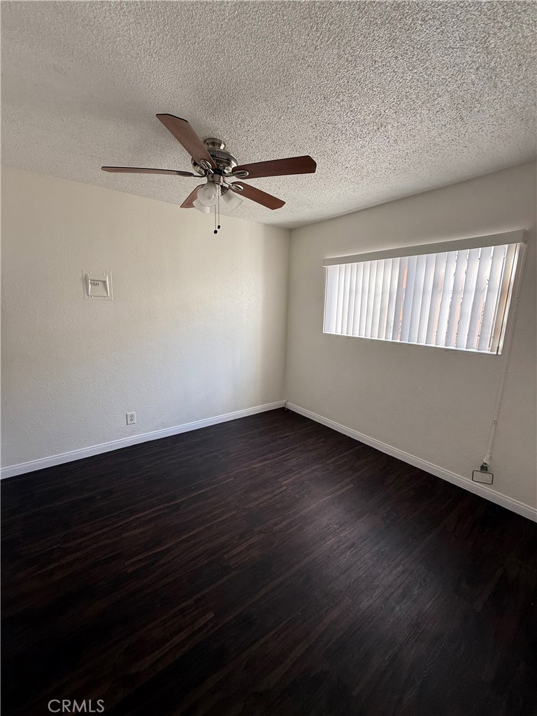 911 East 10th Street Long Beach, CA 90813 - Photo 8 of 19 an empty room with wooden floor and windows
