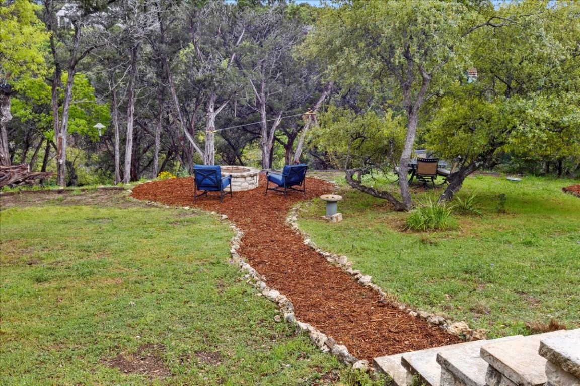a view of a park with large trees