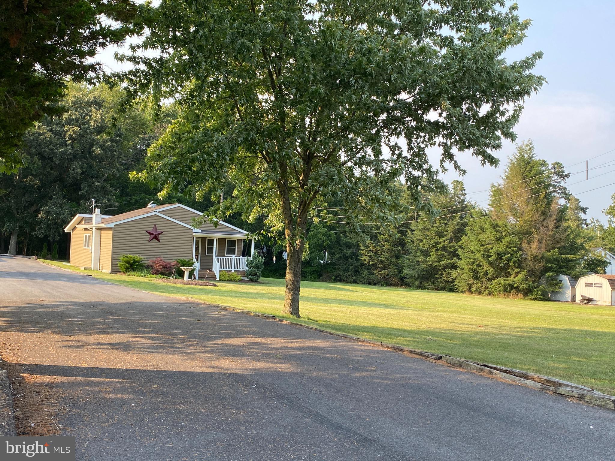 143 Weber Road Elmer, NJ 08318 - Photo 3 of 53 a front view of a house with a yard and trees