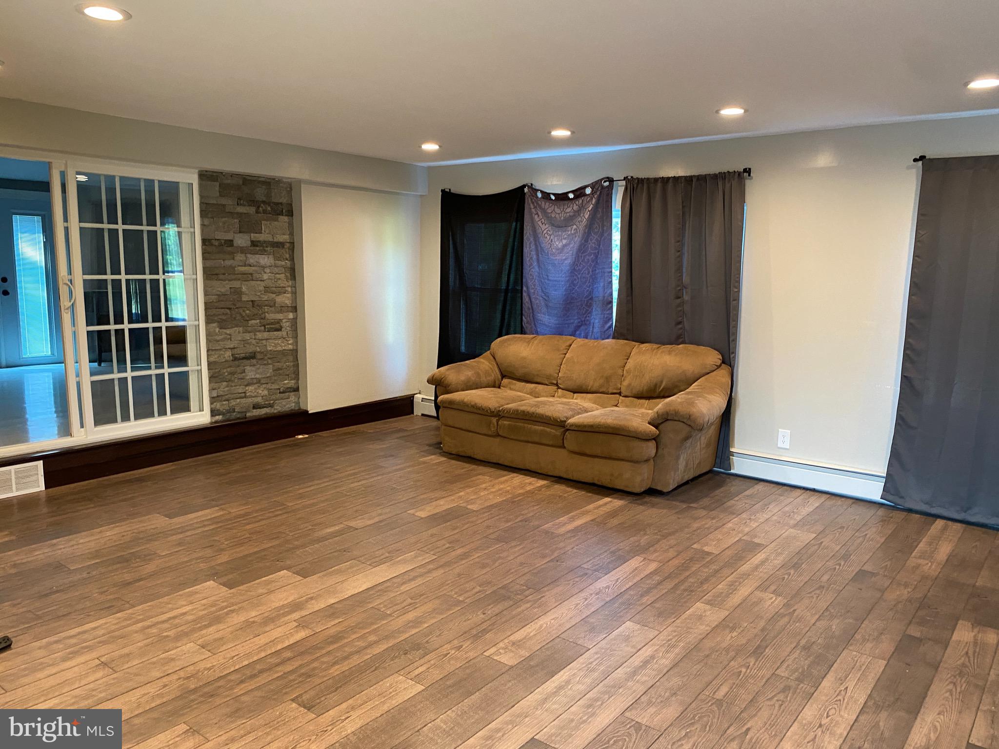 143 Weber Road Elmer, NJ 08318 - Photo 40 of 53 a living room with furniture and a window