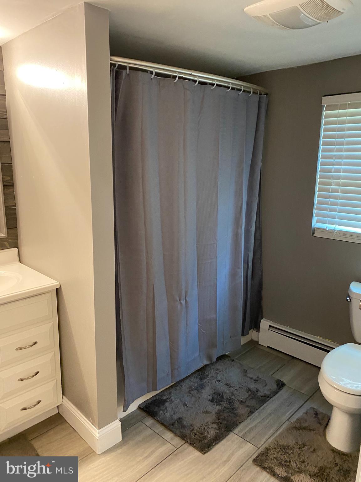 143 Weber Road Elmer, NJ 08318 - Photo 50 of 53 a bathroom with a sink and a toilet
