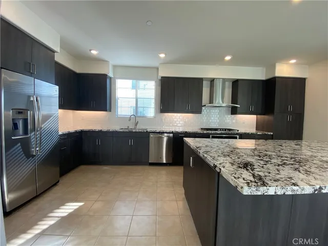 a view of a big room with windows and chandelier in a room