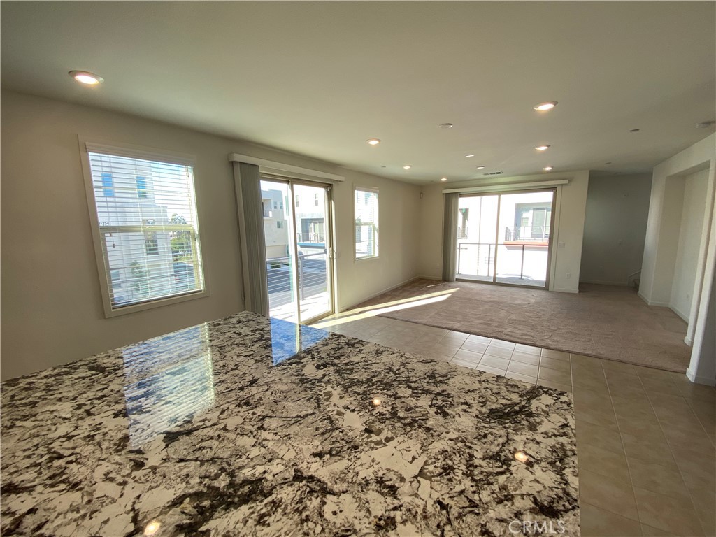 179 Cadence Irvine, CA 92618 - Photo 16 of 41 a view of a big room with windows and chandelier in a room