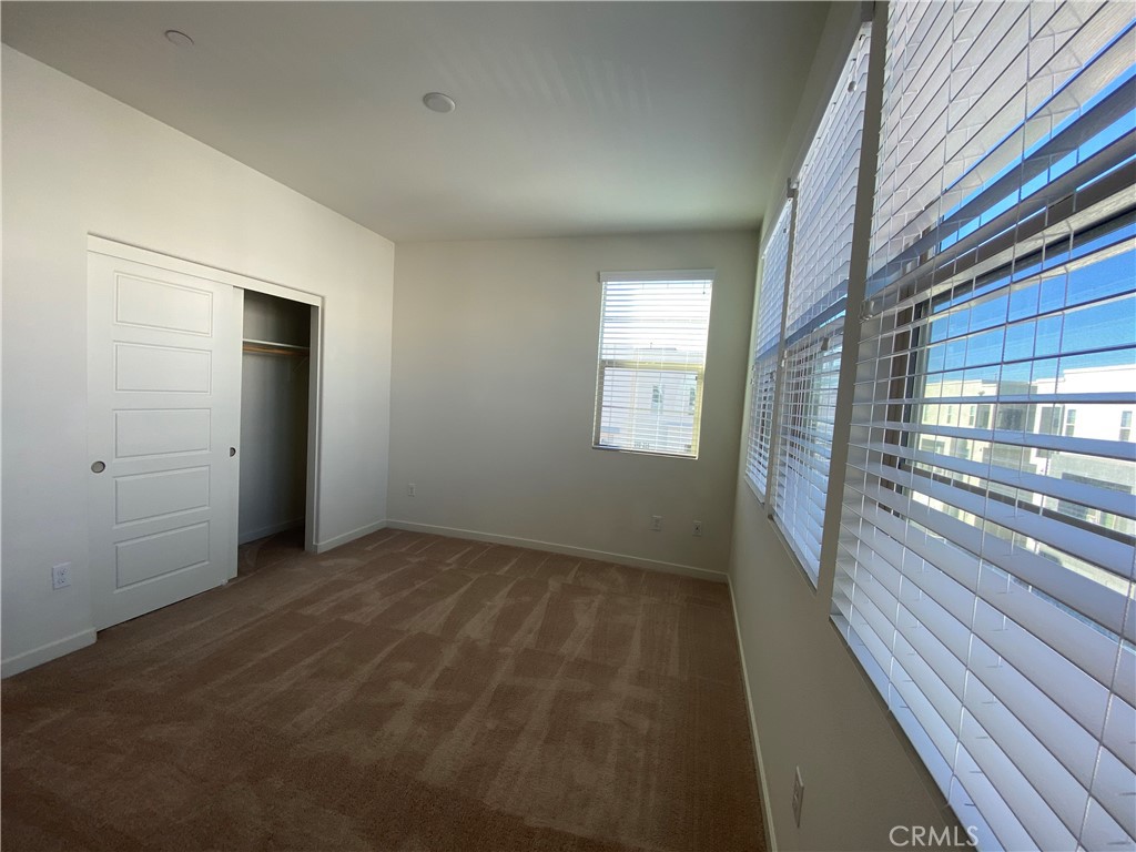 179 Cadence Irvine, CA 92618 - Photo 24 of 41 a view of an empty room with glass door