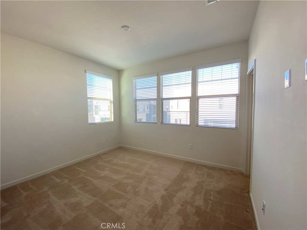 179 Cadence Irvine, CA 92618 - Photo 26 of 41 an empty room with windows