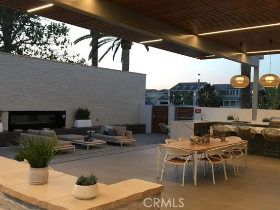 179 Cadence Irvine, CA 92618 - Photo 35 of 41 a view of a patio with couches chairs and a potted plant