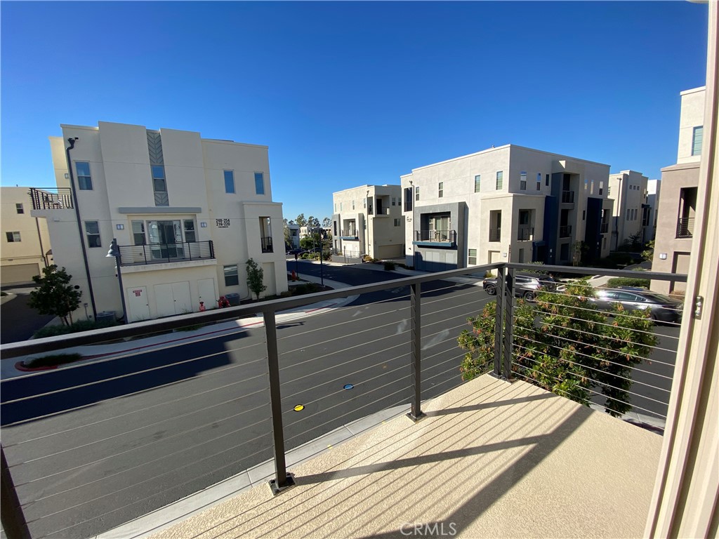 179 Cadence Irvine, CA 92618 - Photo 4 of 41 a view of a building from a balcony