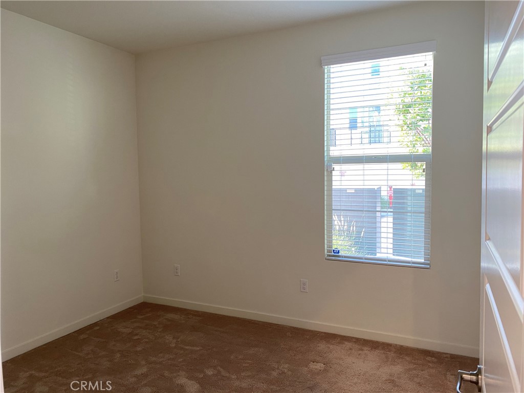179 Cadence Irvine, CA 92618 - Photo 7 of 41 an empty room with a window