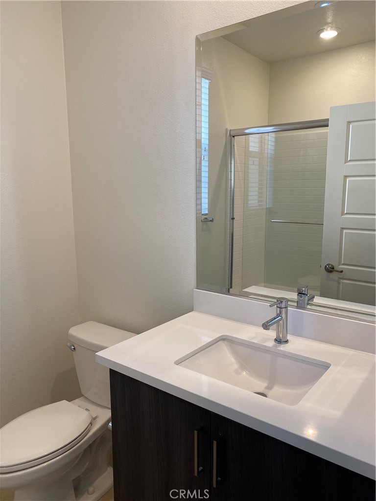 179 Cadence Irvine, CA 92618 - Photo 8 of 41 a bathroom with a sink and a toilet