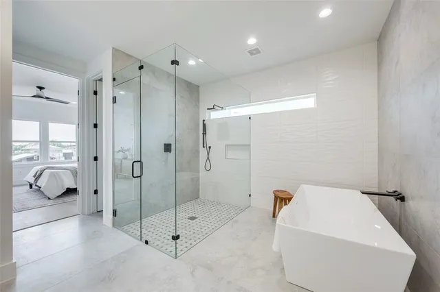 a bathroom with a shower and bathtub