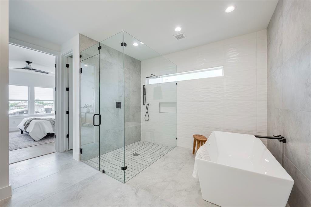 5710 Vanderbilt Avenue Dallas, TX 75206 - Photo 13 of 37 a bathroom with a shower and bathtub