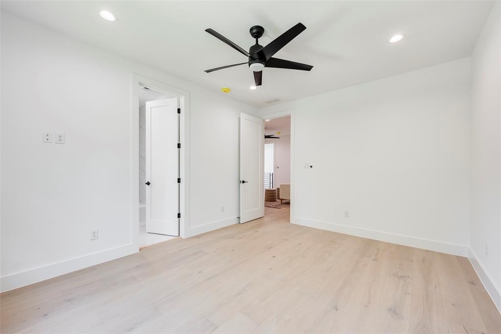 5710 Vanderbilt Avenue Dallas, TX 75206 - Photo 26 of 37 an empty room with closet and ceiling fan