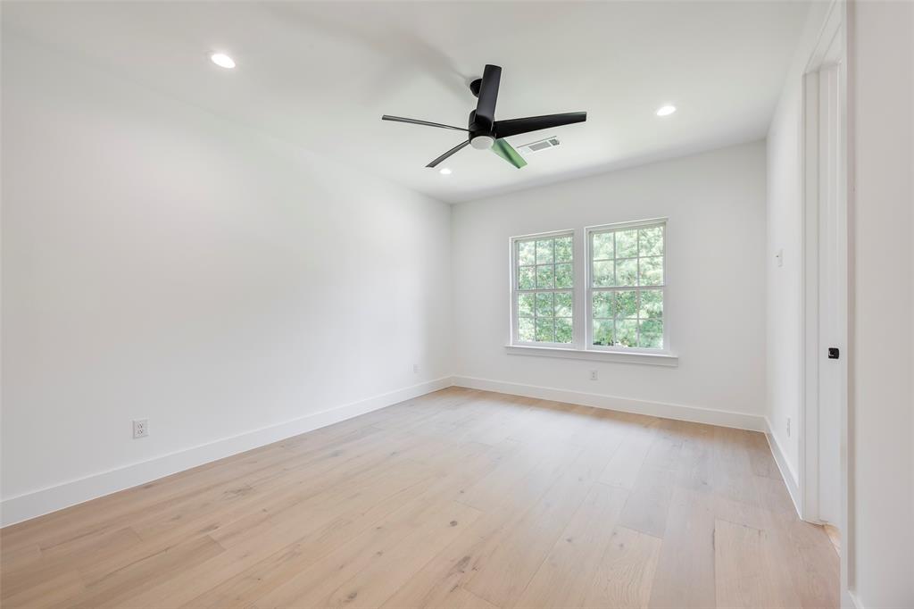 5710 Vanderbilt Avenue Dallas, TX 75206 - Photo 27 of 37 an empty room with a window and a fan