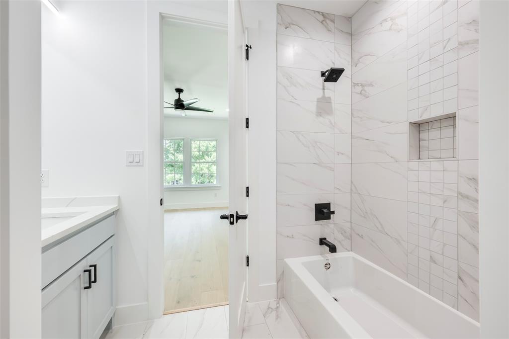 5710 Vanderbilt Avenue Dallas, TX 75206 - Photo 29 of 37 a bathroom with a bathtub and shower