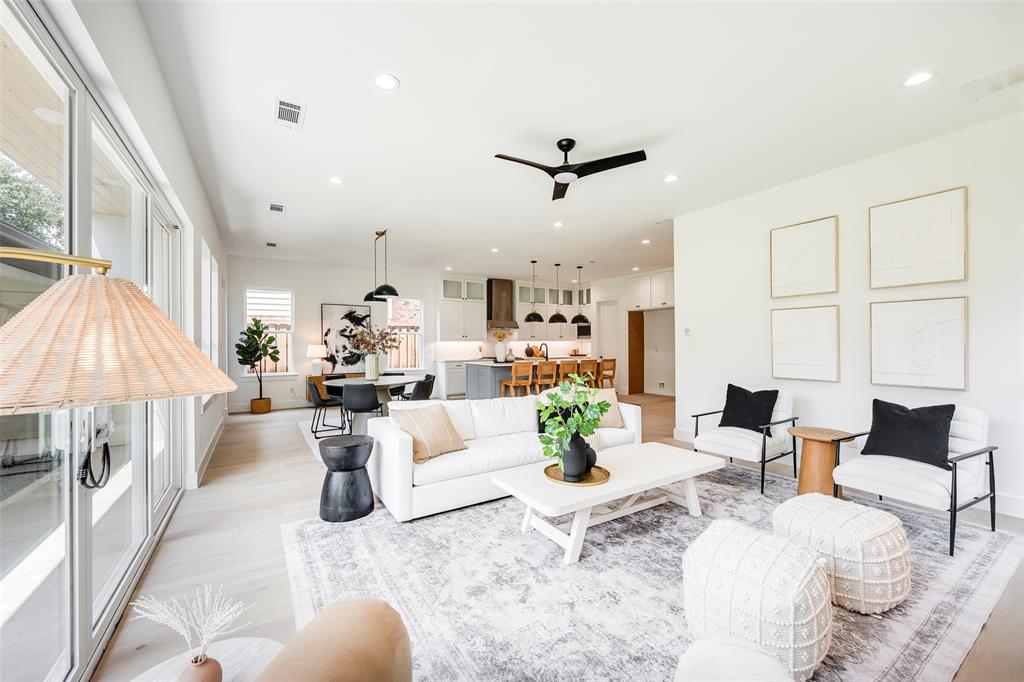 5710 Vanderbilt Avenue Dallas, TX 75206 - Photo 8 of 37 a living room with furniture and a chandelier