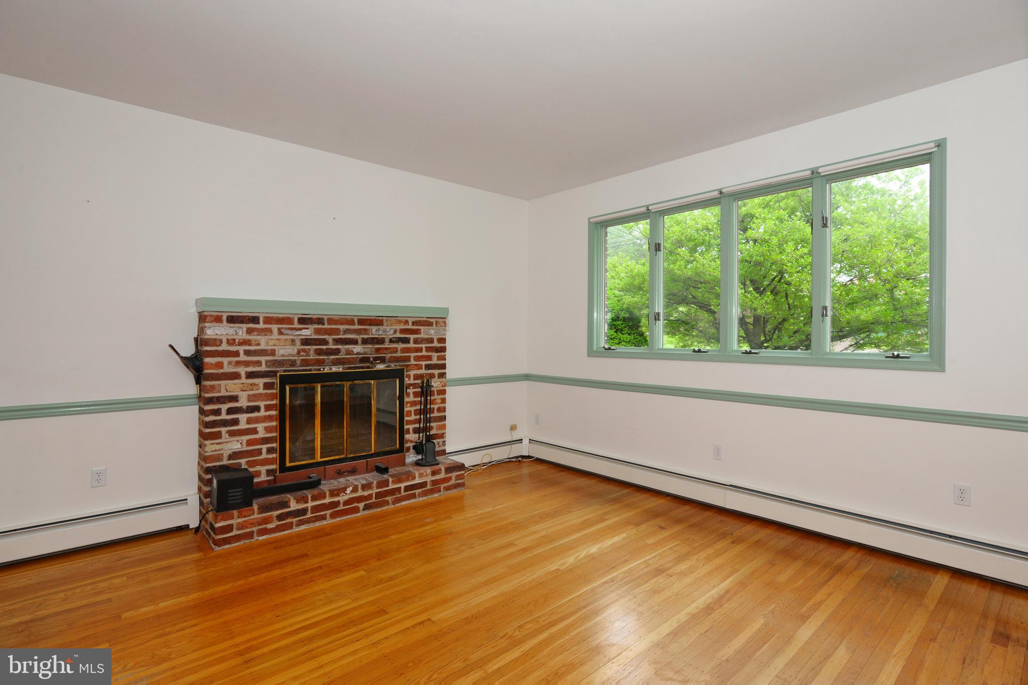 479 Quarry Road Harleysville, PA 19438 - Photo 5 of 33 Sunlit Living Room with Fireplace