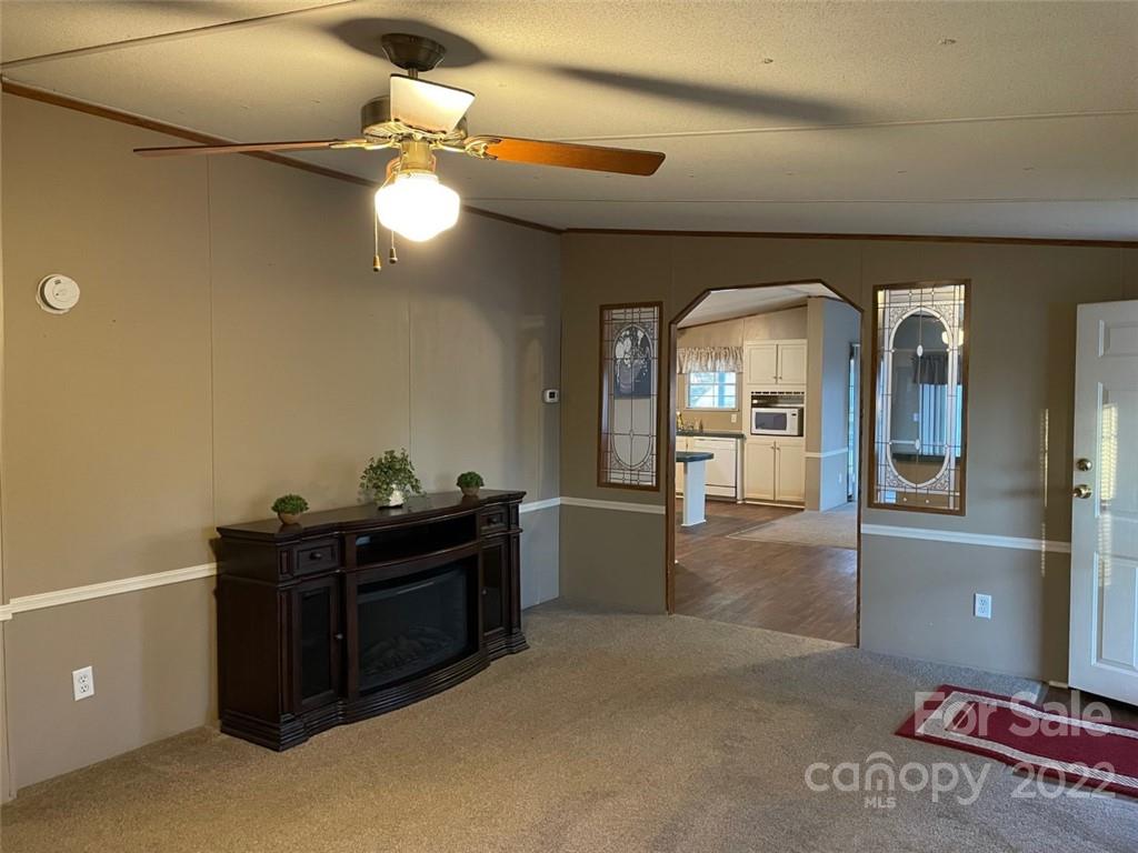 247 Tirzah Church Road, Unit 3 Lancaster, SC 29720 - Photo 11 of 31 a view of a livingroom with furniture and cabinet