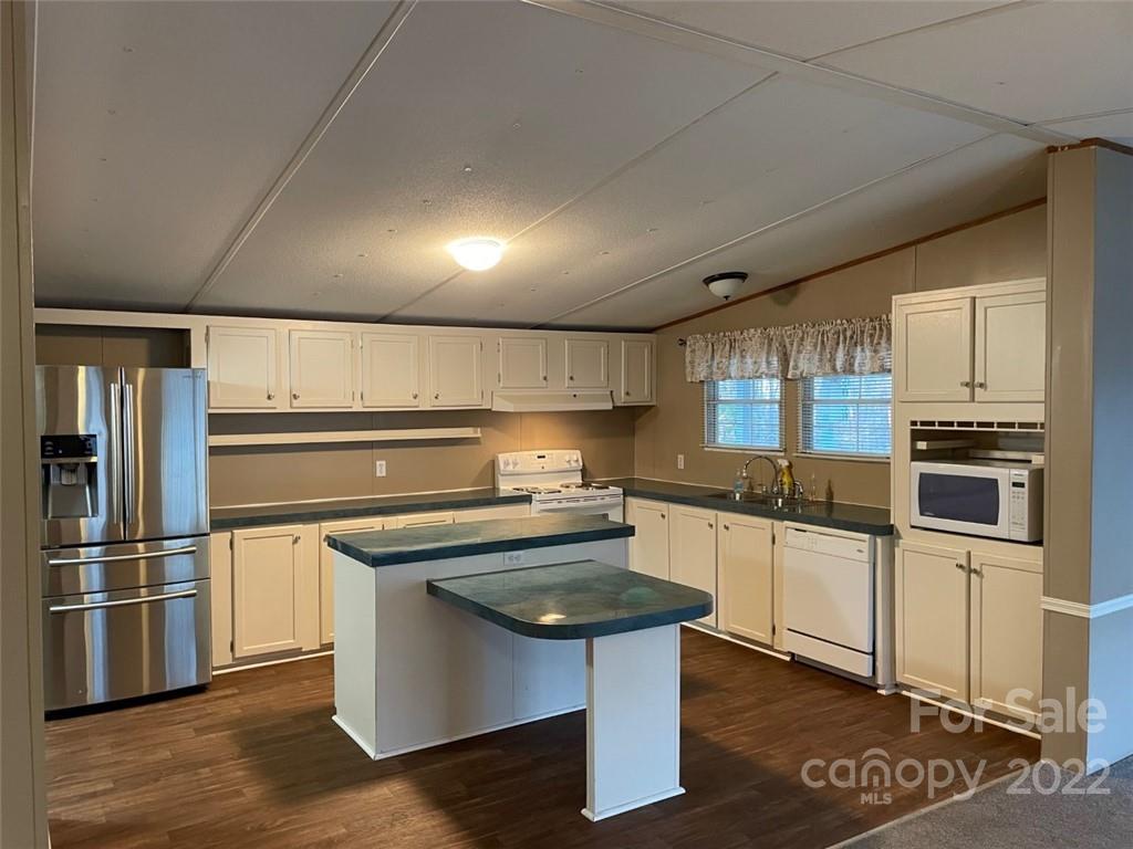247 Tirzah Church Road, Unit 3 Lancaster, SC 29720 - Photo 18 of 31 a kitchen with stainless steel appliances granite countertop a sink stove and refrigerator