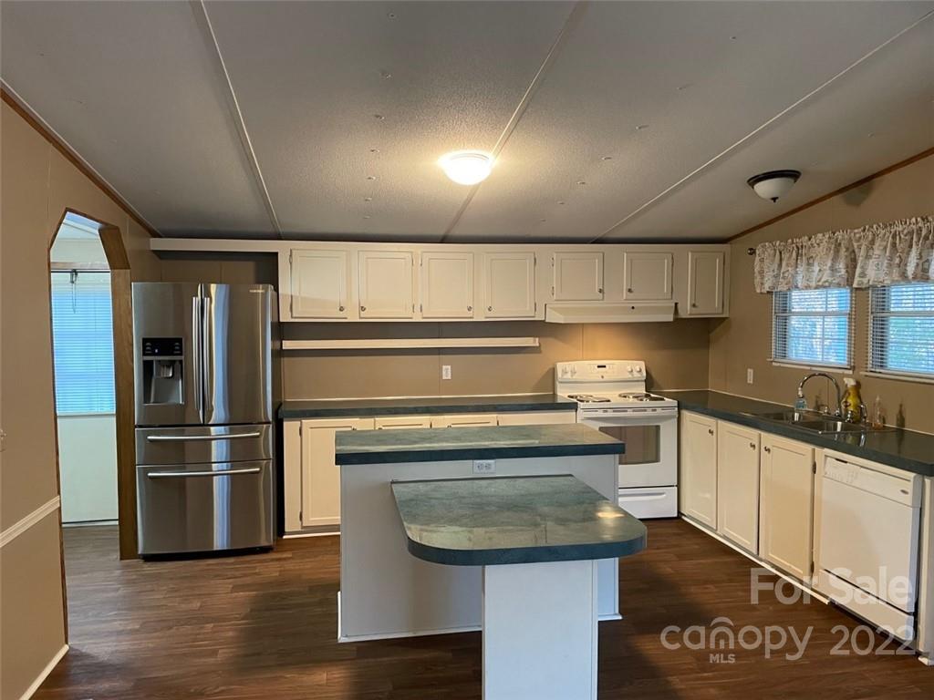 247 Tirzah Church Road, Unit 3 Lancaster, SC 29720 - Photo 19 of 31 a kitchen with granite countertop a sink stainless steel appliances and cabinets