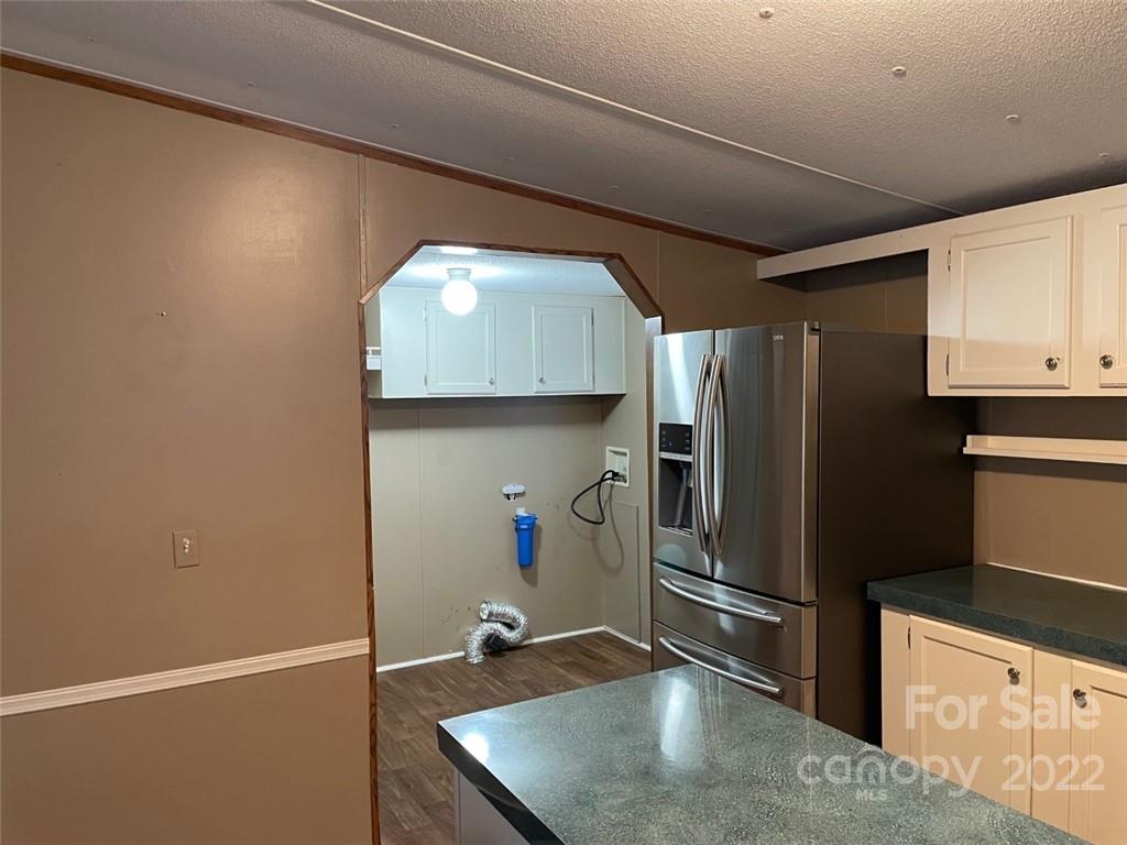 247 Tirzah Church Road, Unit 3 Lancaster, SC 29720 - Photo 20 of 31 a kitchen with a refrigerator and a sink
