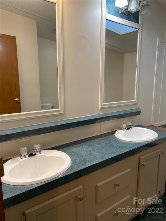 247 Tirzah Church Road, Unit 3 Lancaster, SC 29720 - Photo 24 of 31 a bathroom with a sink and a mirror