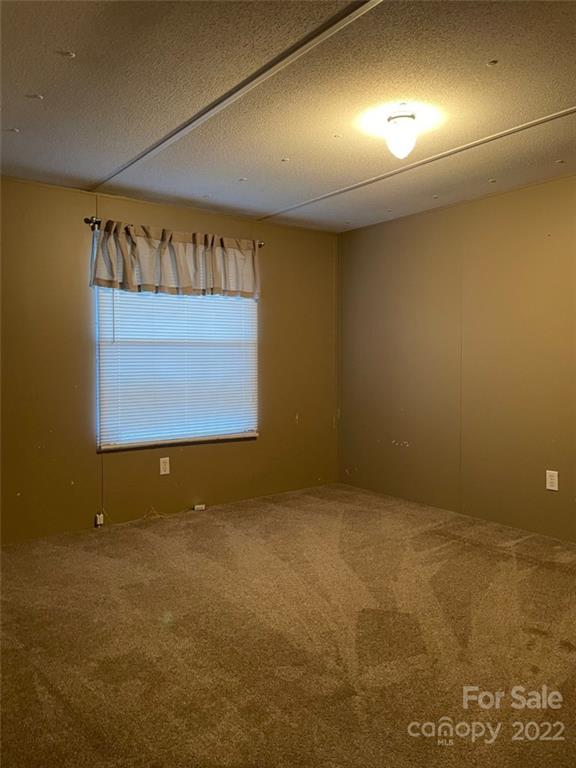 247 Tirzah Church Road, Unit 3 Lancaster, SC 29720 - Photo 26 of 31 an empty room with windows
