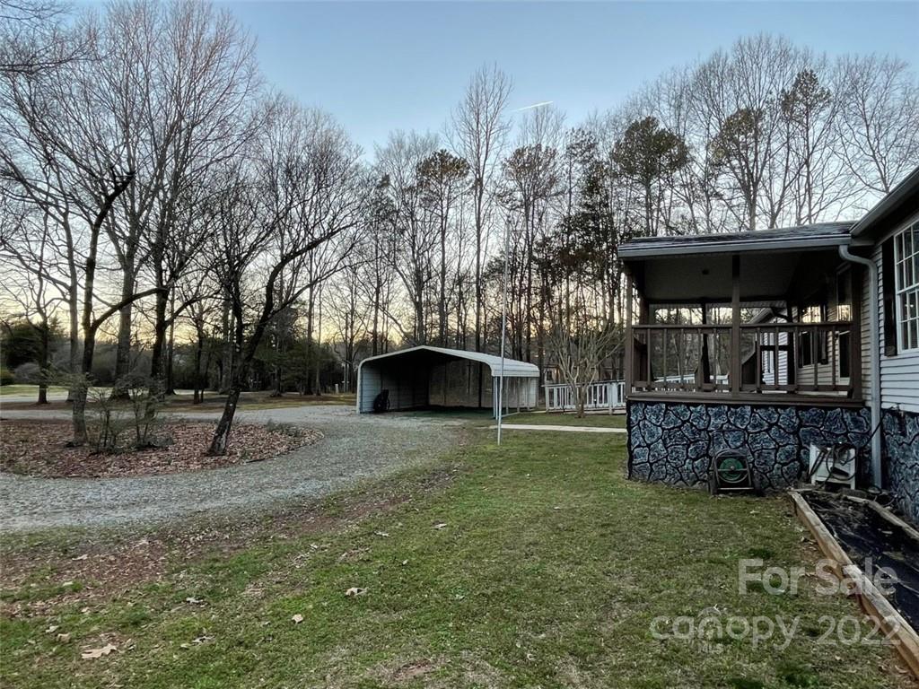 247 Tirzah Church Road, Unit 3 Lancaster, SC 29720 - Photo 6 of 31 a backyard of a house with lots of green space