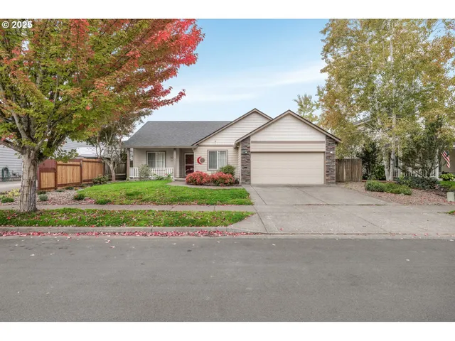 a front view of a house with a garden