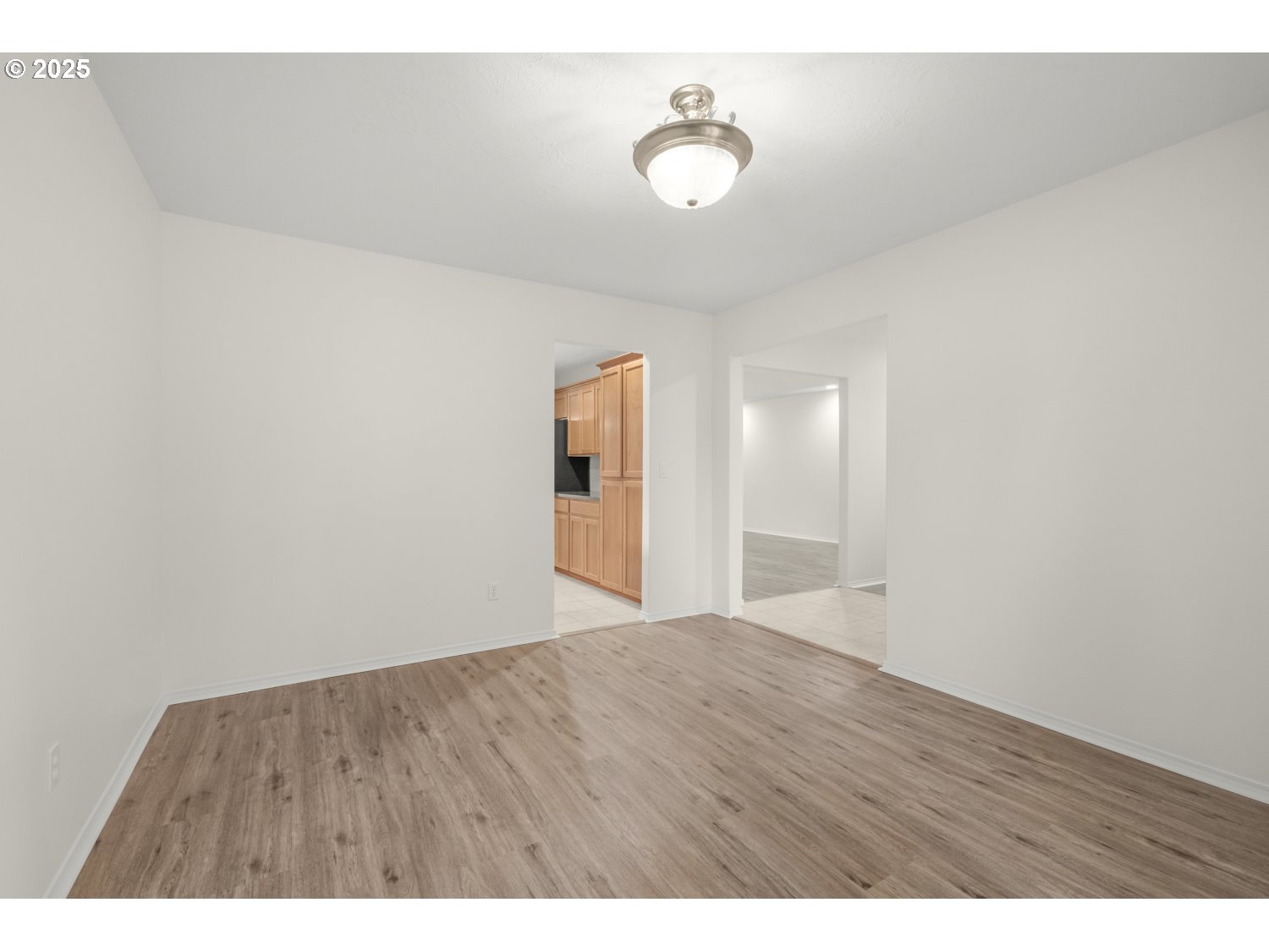 1930 Salmon Run Southwest Albany, OR 97321 - Photo 12 of 26 a view of an empty room with wooden floor