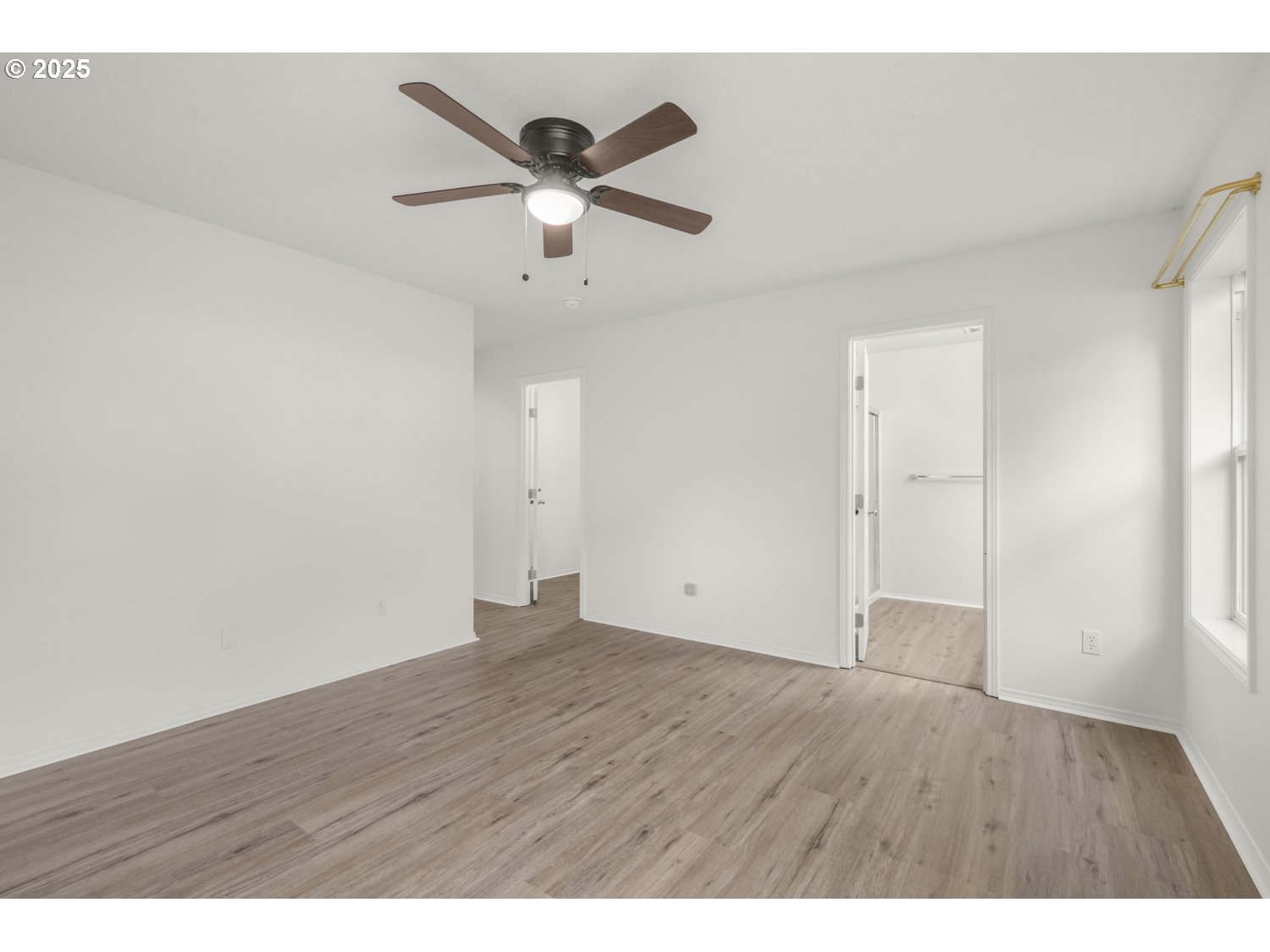 1930 Salmon Run Southwest Albany, OR 97321 - Photo 13 of 26 a view of an empty room with wooden floor