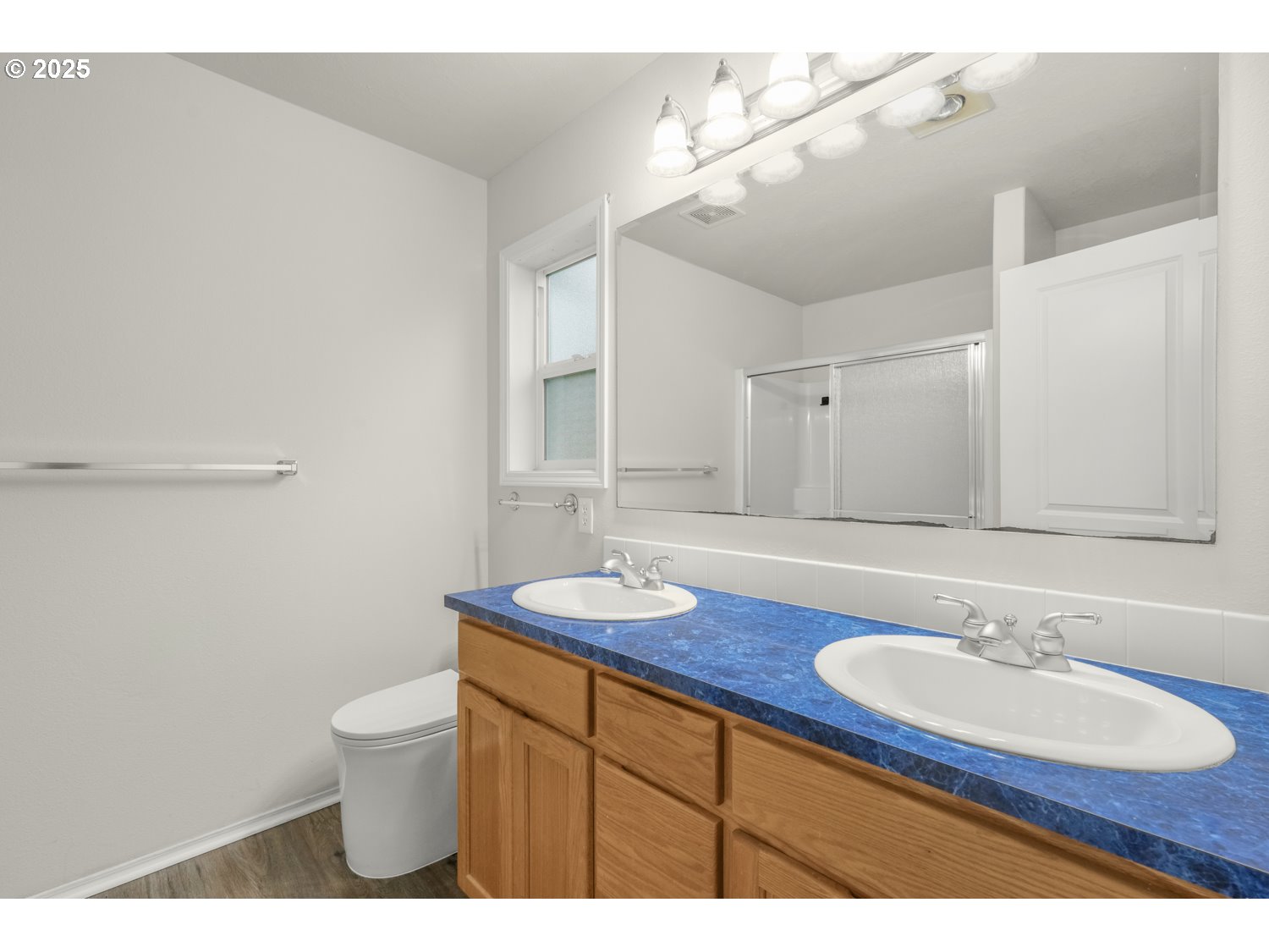 1930 Salmon Run Southwest Albany, OR 97321 - Photo 16 of 26 a bathroom with a granite countertop sink a toilet and a mirror