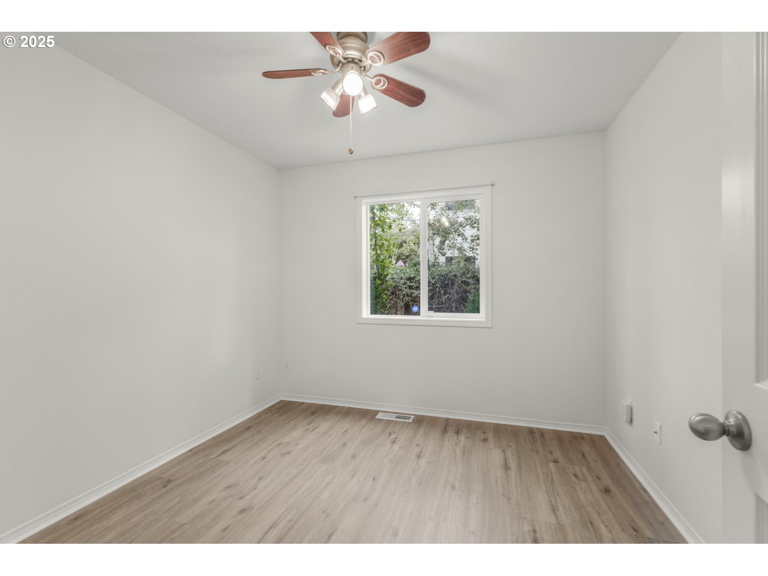 1930 Salmon Run Southwest Albany, OR 97321 - Photo 18 of 26 an empty room with a window and a fan