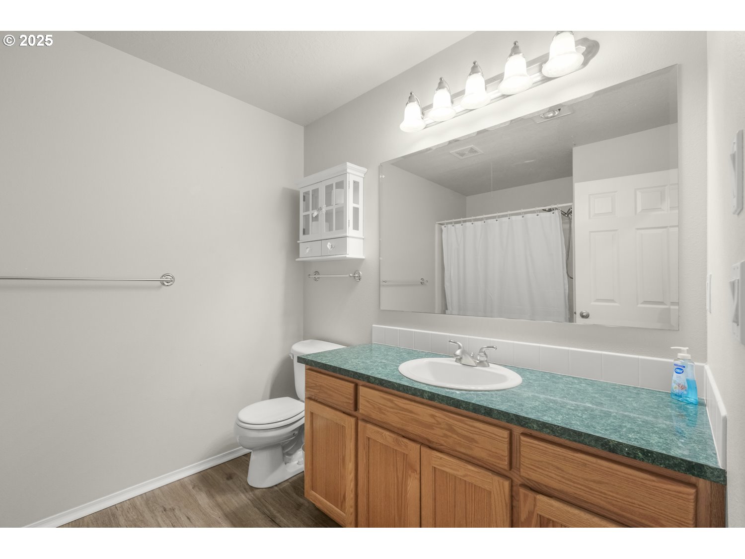 1930 Salmon Run Southwest Albany, OR 97321 - Photo 20 of 26 a bathroom with a granite countertop sink a toilet and mirror