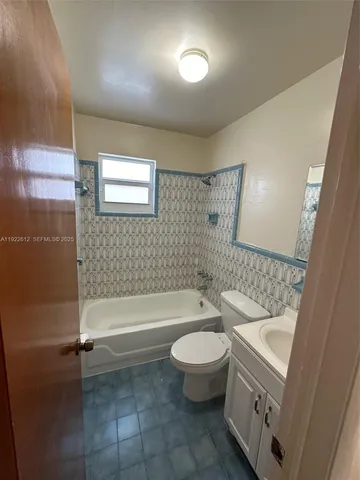 a bathroom with a sink a toilet and bathtub
