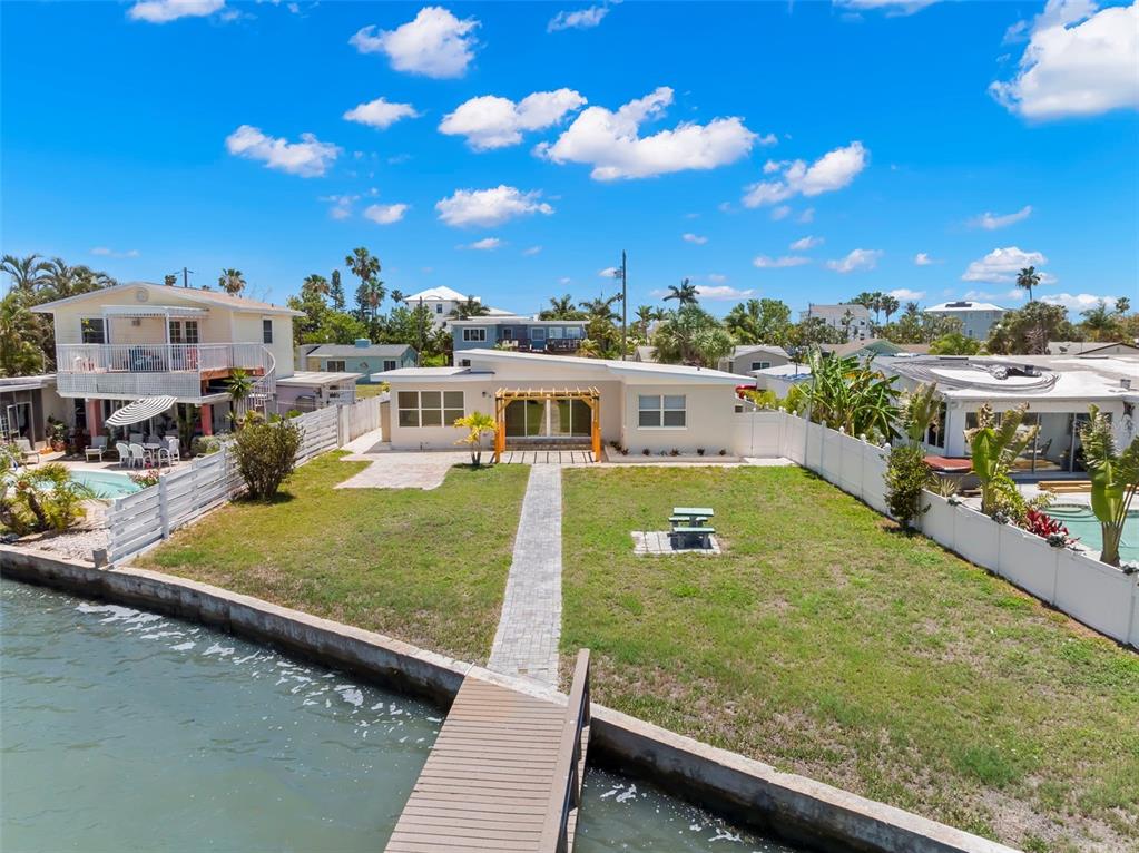 708 Sunset Cove Madeira Beach, FL 33708 - Photo 55 of 61 a view of a swimming pool with outdoor seating