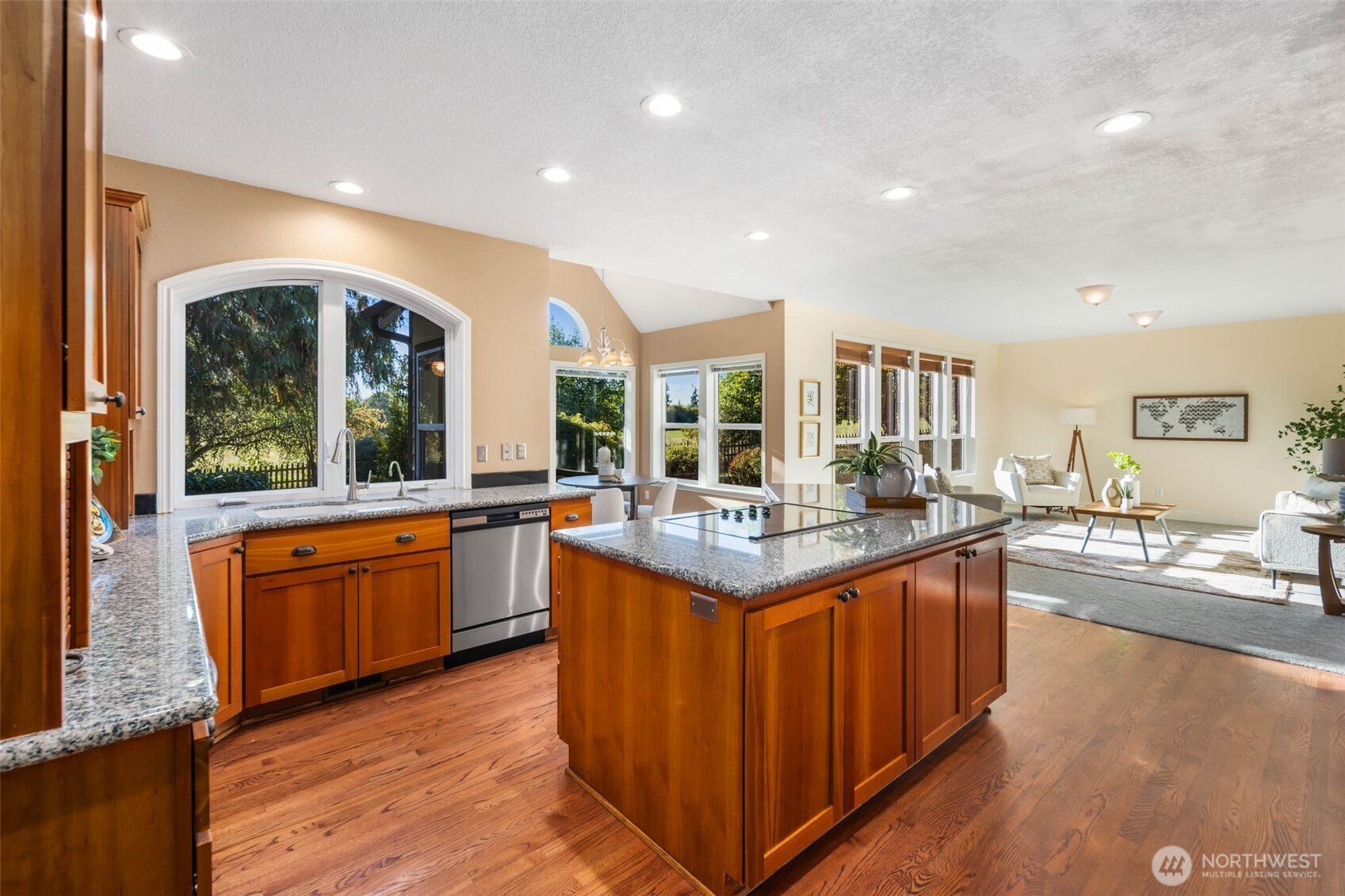 16104 Northeast 6th Court Ridgefield, WA 98642 - Photo 13 of 40 a large kitchen with kitchen island granite countertop a large counter top and sink