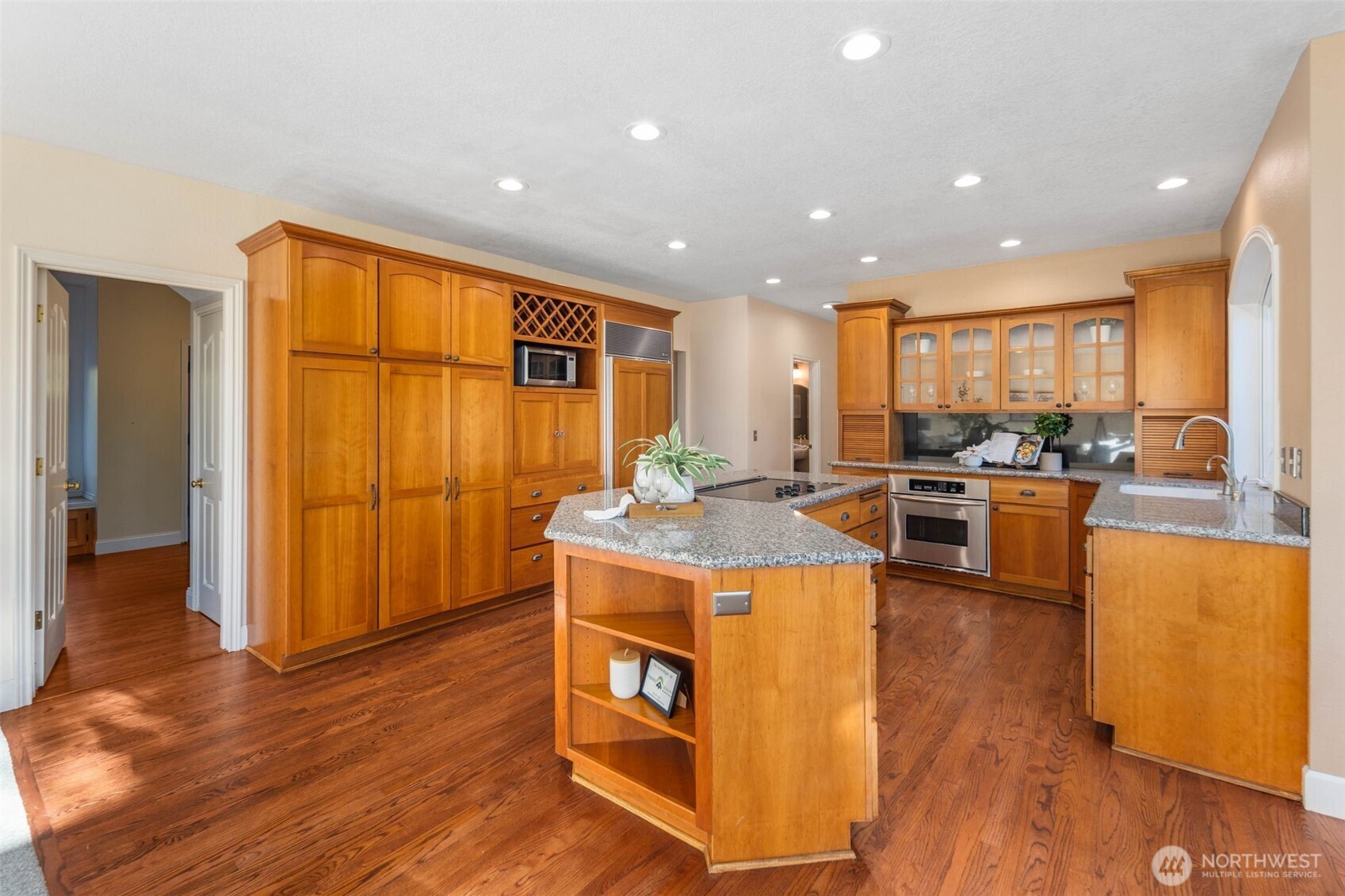 16104 Northeast 6th Court Ridgefield, WA 98642 - Photo 15 of 40 a kitchen with stainless steel appliances granite countertop a stove a sink and a refrigerator
