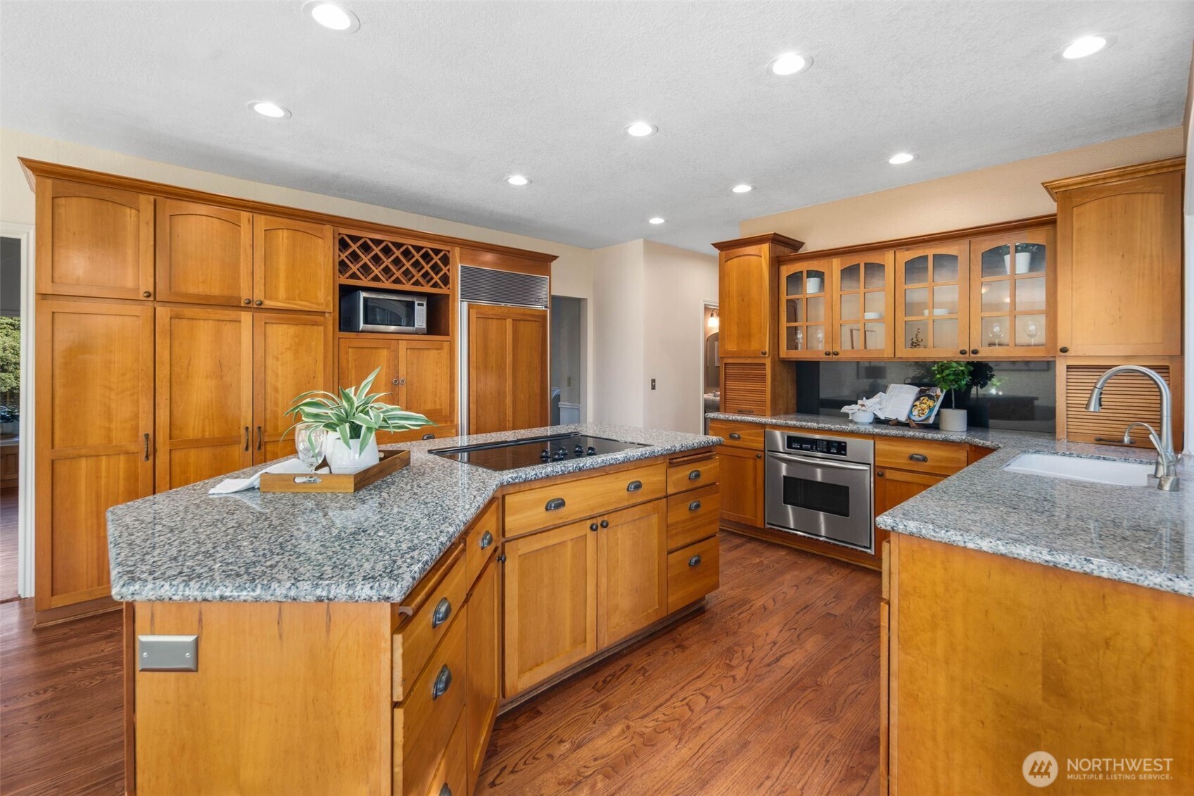 16104 Northeast 6th Court Ridgefield, WA 98642 - Photo 16 of 40 a kitchen with stainless steel appliances granite countertop sink stove and granite counter top