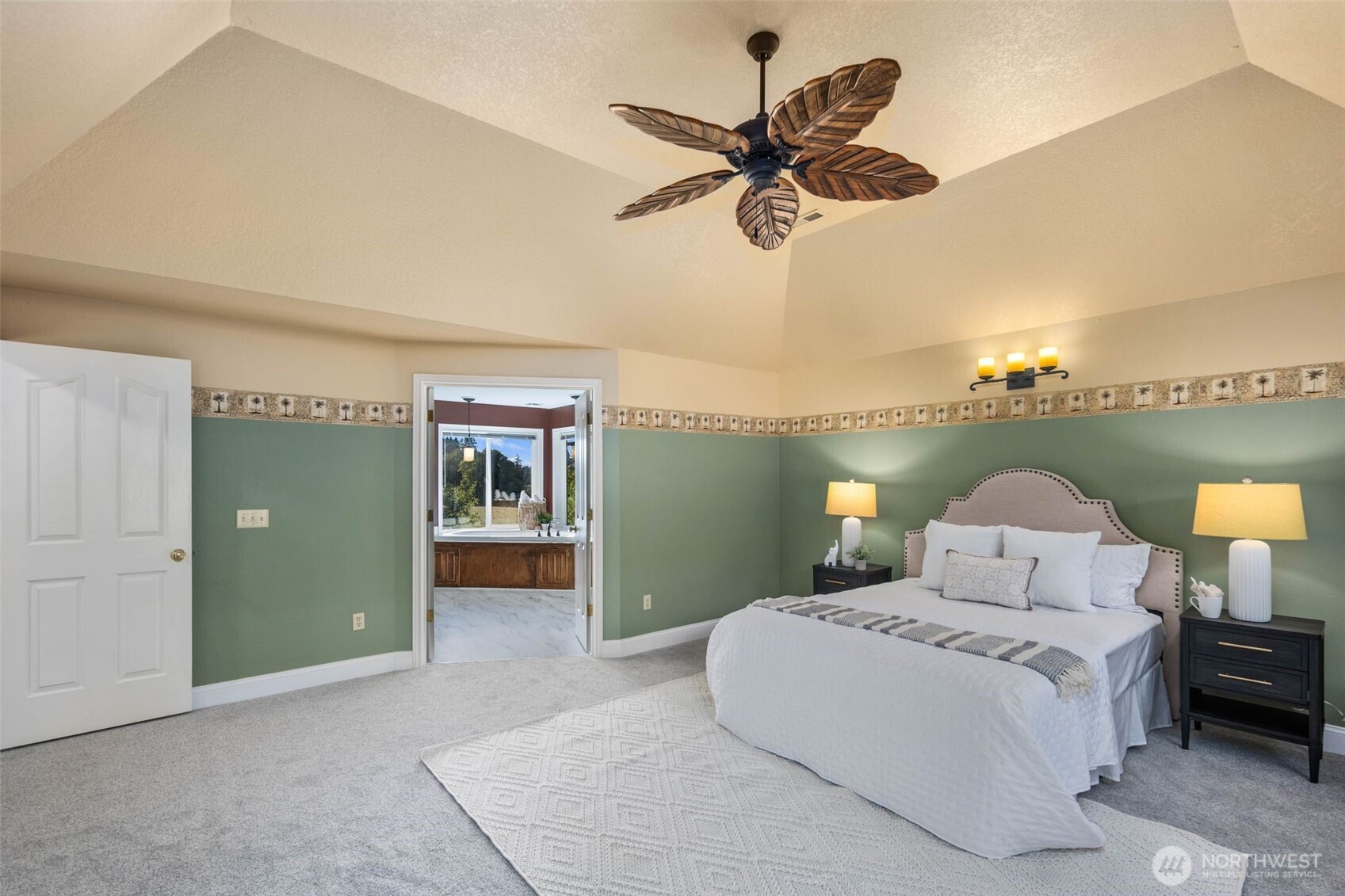 16104 Northeast 6th Court Ridgefield, WA 98642 - Photo 23 of 40 a bedroom with a bed and a chandelier