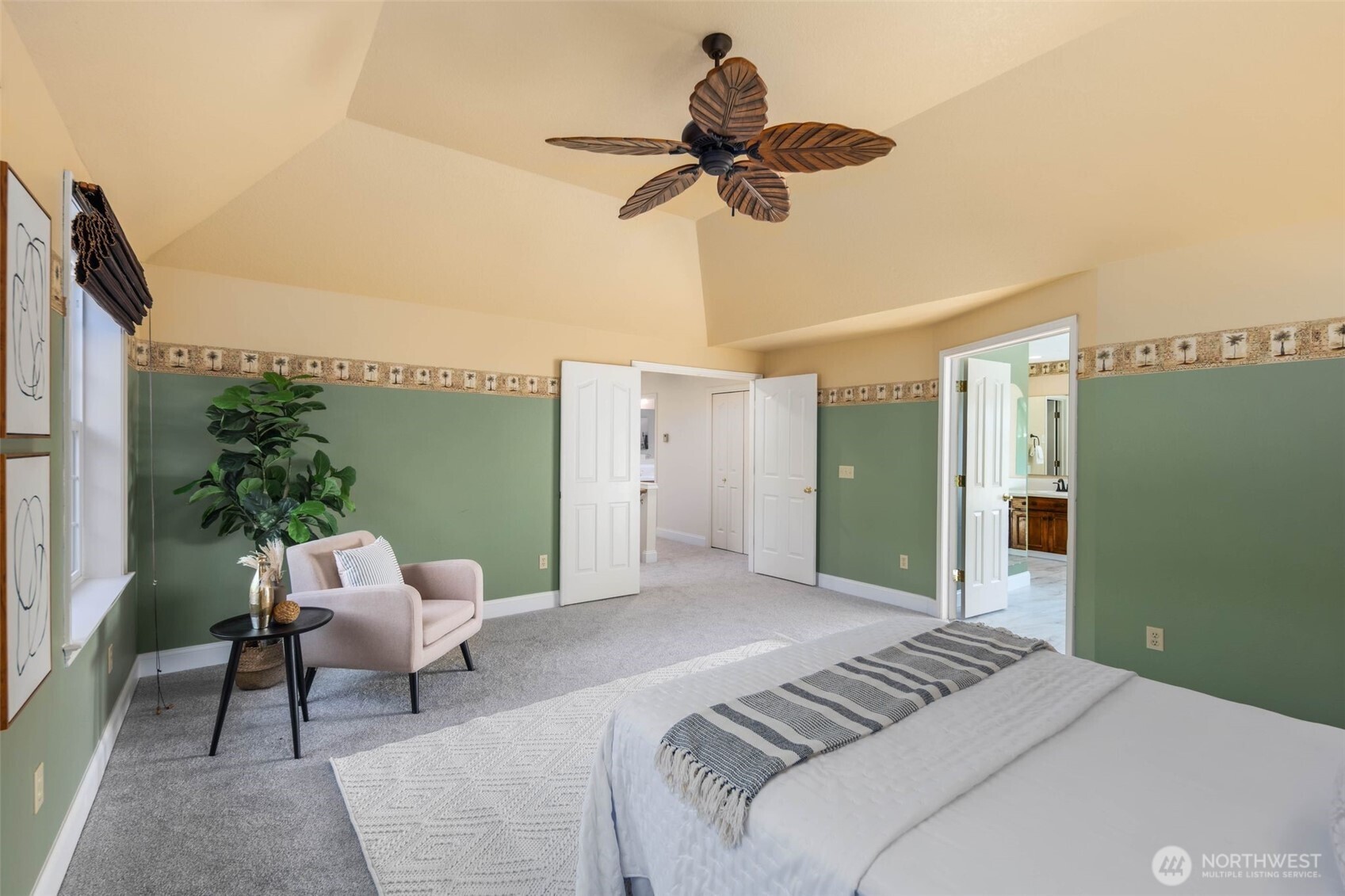16104 Northeast 6th Court Ridgefield, WA 98642 - Photo 24 of 40 a bedroom with a bed and a chandelier